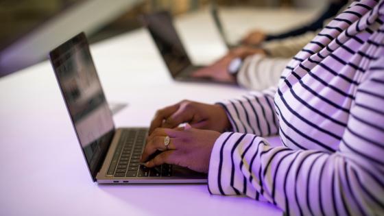 Employee works on laptop