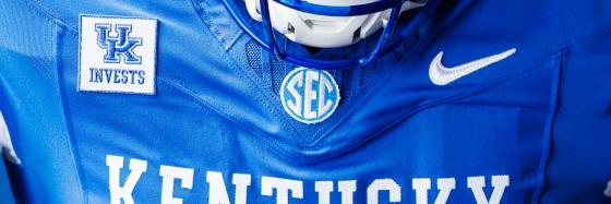 UK Invests lockup prominently displayed on the UK Football jersey, Fall 2026.