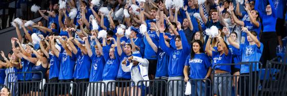 Students cheer at a UK Volleyball match.